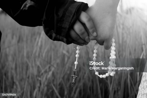 Children Holding Rosary In Hands Stock Photo - Download Image Now - Virgin Mary, Praying, Rosary Beads