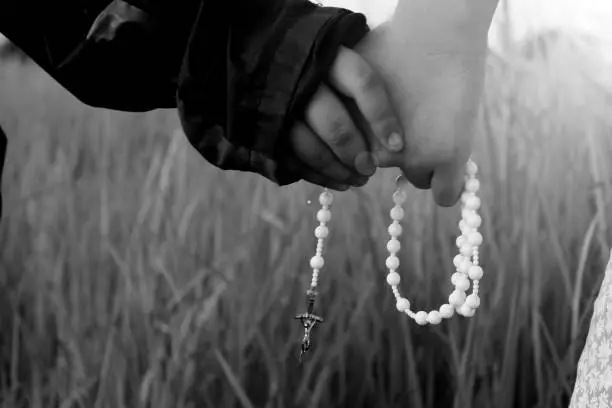 Photo of Children holding Rosary in hands.