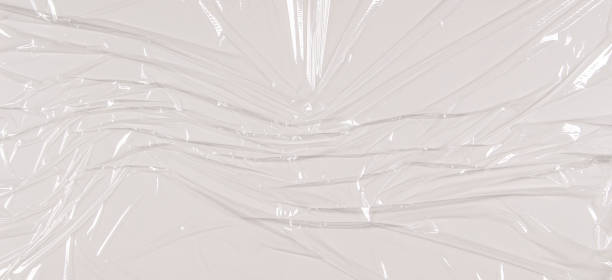 istock Transparent film cellophane background. White wrinkled stretched plastic texture background 1347419762