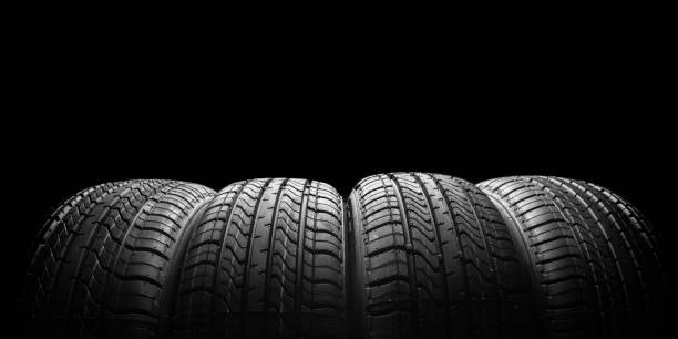 istock black isolation rubber tire, on the black backgrounds 1347422672