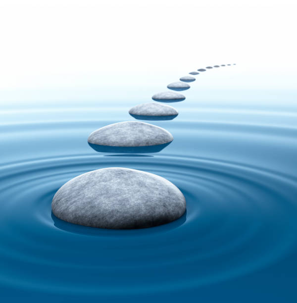 istock Stones in blue water ripples and  reflections 1347425335