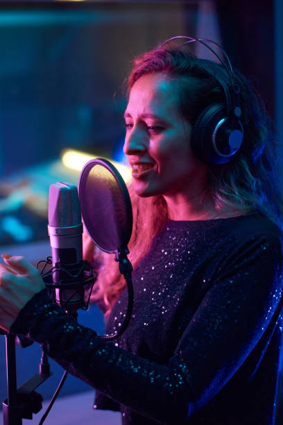istock Singer recording a new song in the studio 1347426575