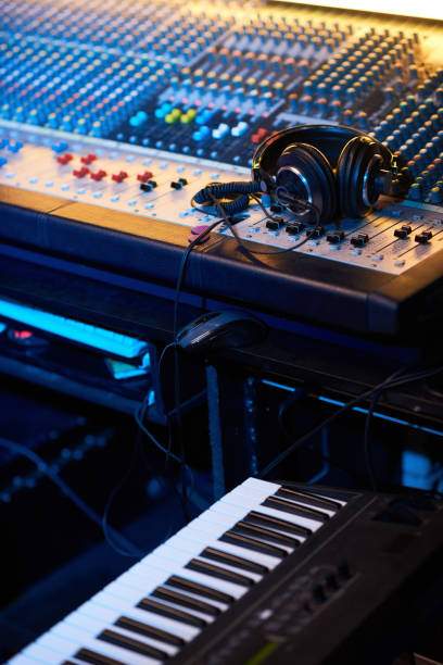 istock Headphones on music studio keyboard 1347426679