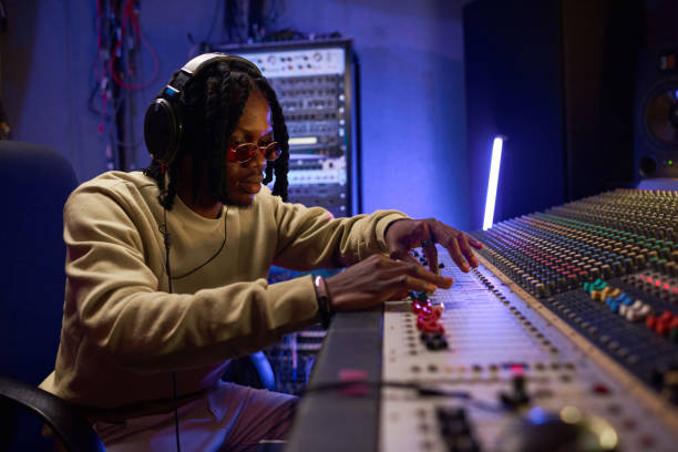 istock Musical producer creating new songs in studio 1347426691