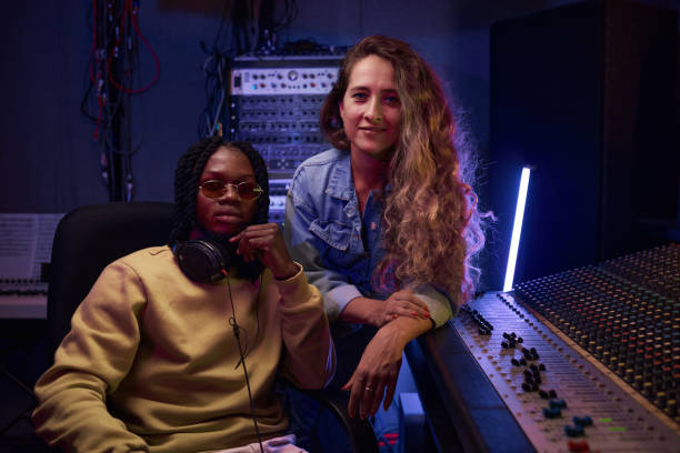 istock Singer with producer working in studio 1347426734