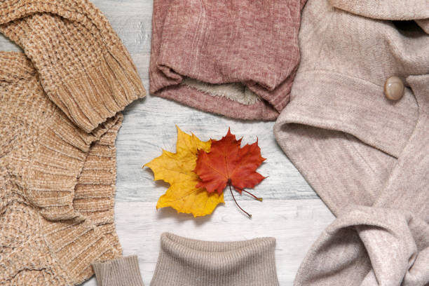 istock Warm clothes of beige tones. Top view 1347426900