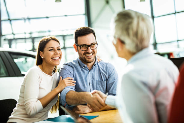 istock Congratulations, we have a deal about buying a car! 1347429749