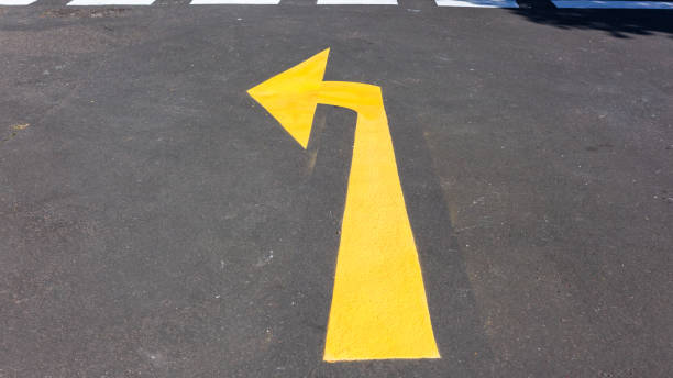 istock Road Direction Sign Yellow Arrow 1347429954
