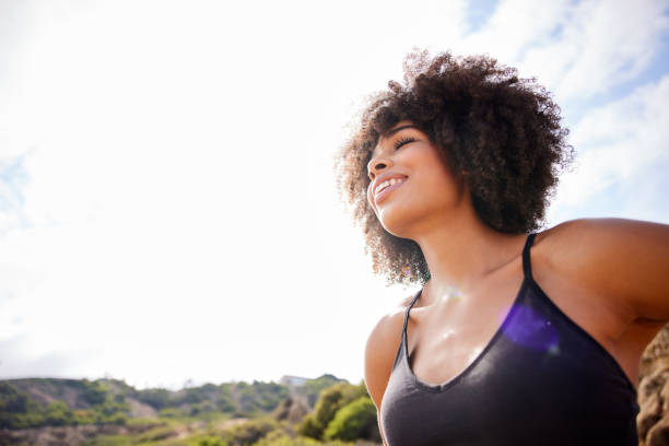 istock Fit woman taking a deep breath during a run outside in summer 1347430773
