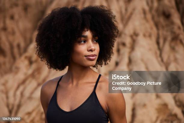 Fit Woman Standing Outdoors After A Late Afternoon Trail Run Stock Photo - Download Image Now