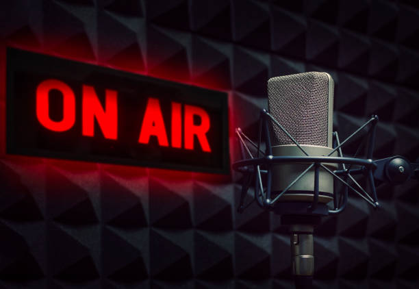 istock Professional microphone and on air sign 1347432204