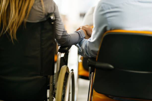 istock Support of disabled girlfriend on a business seminar! 1347435051