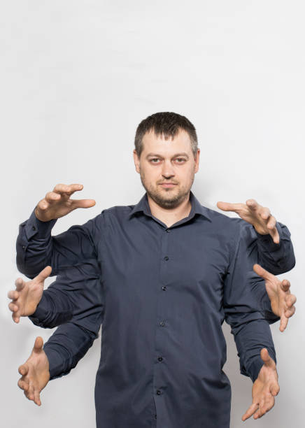 istock A Caucasian young man with six arms on a white background. 1347435749
