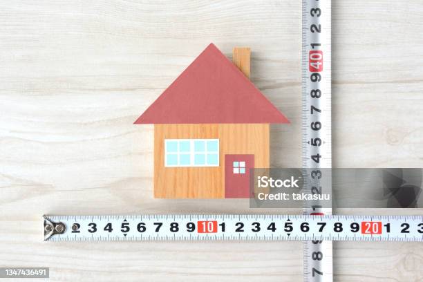 House Object And Tape Measure Measuring House Size Images Stock Photo - Download Image Now