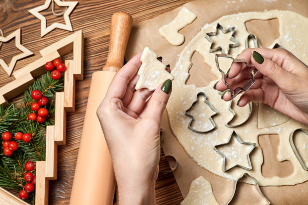 istock The girl is Making gingerbread Christmas Cookies Using form for cooking 1347441851