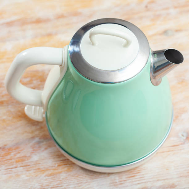 istock Image of new teapot on table in home interior 1347442556