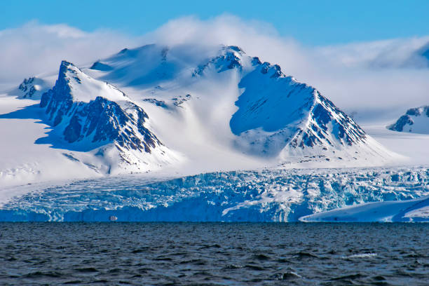 istock Deep Blue Glacier and Snowcapped Mountains, Arctic, Svalbard, Norway 1347443338