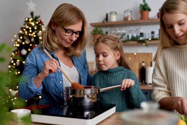 istock Three generations of women spending time in the kitchen 1347443566