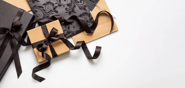 istock Black Friday sale concept, Gift boxes with black ribbons on white background, top view. 1347444039