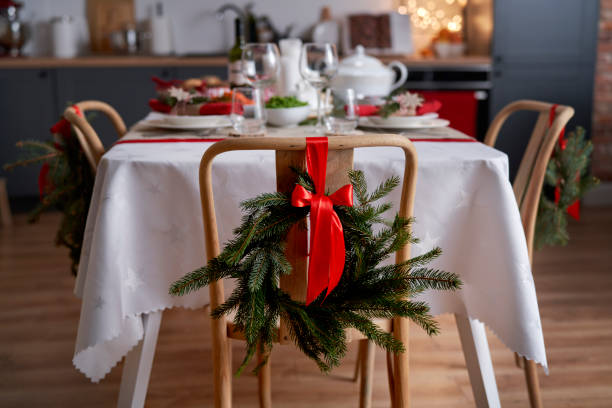 Table prepared for Christmas dinner Table prepared for Christmas dinner medium shot stock pictures, royalty-free photos & images