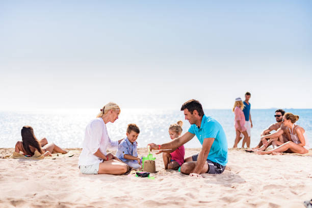 istock Large group of people spending a summer day on beach. 1347449892