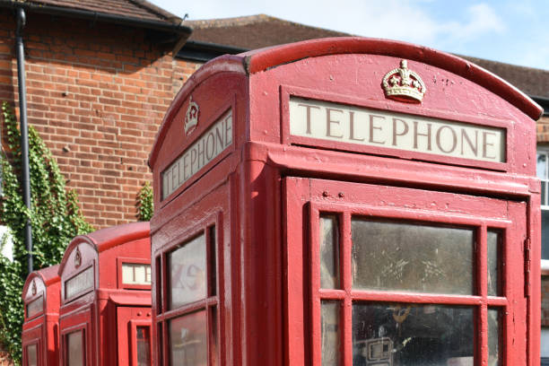 istock close up of 3 vintage red telephone boxes 1347450188