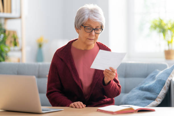 istock woman with a paper receipt 1347450394