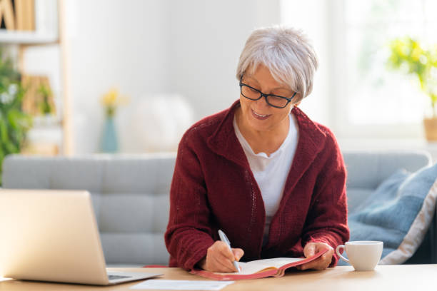 istock woman working on a laptop at home. 1347451444