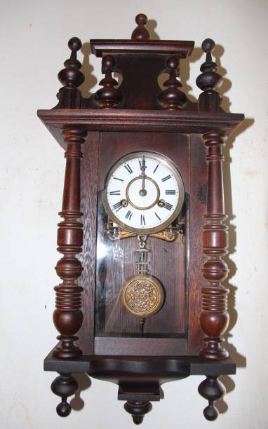 istock Antique clock hanging with wooden wall 1347455957