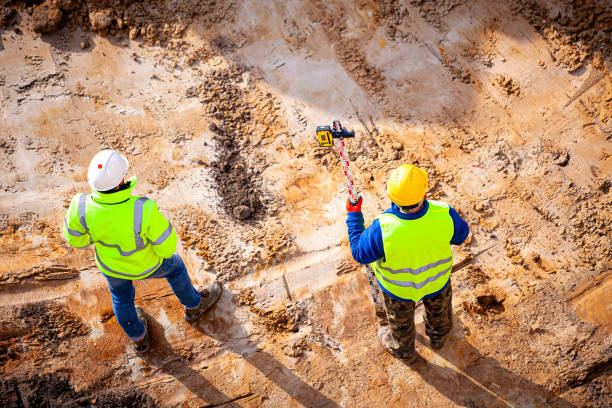 istock Surveyors and construction manager at the construction site 1347456156