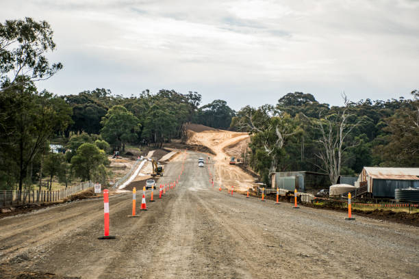 Roadworks on a highway with gravel road in Australia. Roadworks with gravel road in Australia. Road costruction works on Nerriga Road, NSW speed limit sign australia stock pictures, royalty-free photos & images