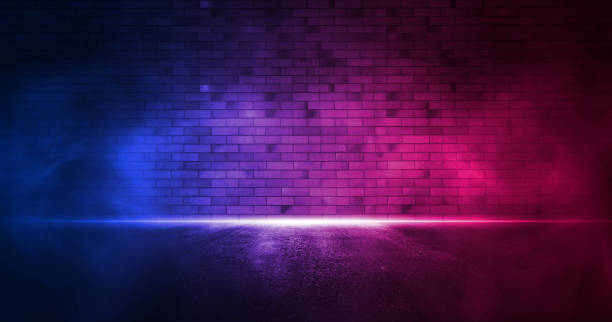 istock Rays neon light on neon brick wall. Empty scene. Neon reflections on wet asphalt. Cyberpunk background with copy space. 1347457750