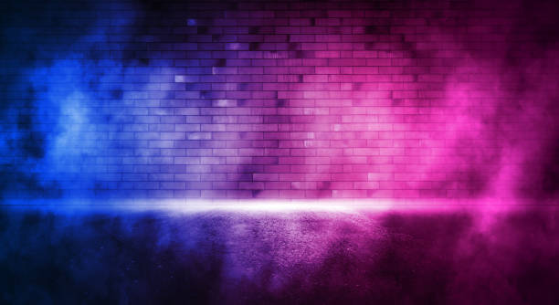 istock Rays neon light on neon brick wall. Empty scene. Neon reflections on wet asphalt. Cyberpunk background with copy space. 1347457793