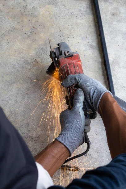 istock Close up, A man working with angle grinder. Iron gate repair 1347460381