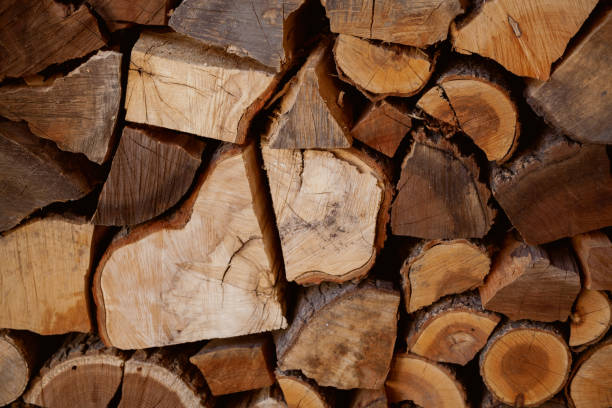 istock Chopped firewood stacked in rows close-up 1347460651