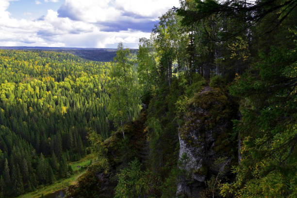 istock White, plaster, moss-covered sheer cliffs of Usvinskie Stolby 1347461919