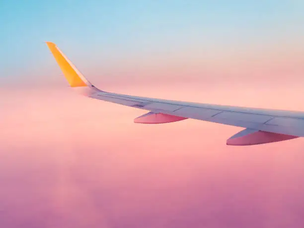 Photo of Surreal purple view from an airplane window, fantastic dream vacation flight, concept