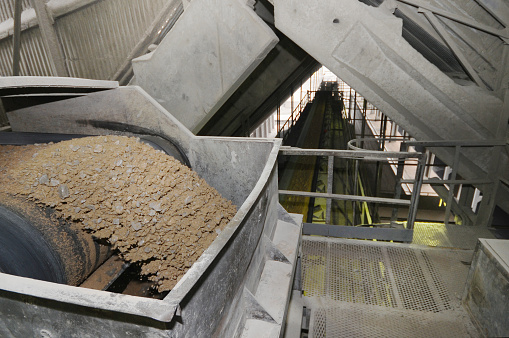 Close up of production line with small crushed stones and gravel