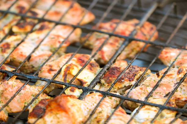 istock bbq grill meat, ready chicken legs on grid over charcoal 1347464563