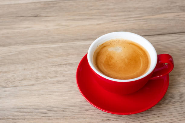 istock Hot espresso coffee on table, Red coffee cup in cafe or home.Top view with blank copy space for your text. 1347466972