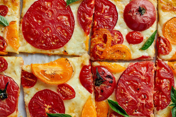 istock Delicious homemade square pizza with vegetables on white 1347468912