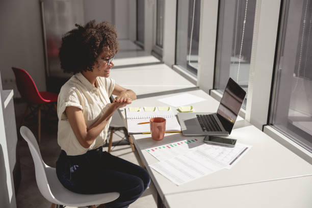 istock Happy lady communicating in sign language online at a laptop 1347470214