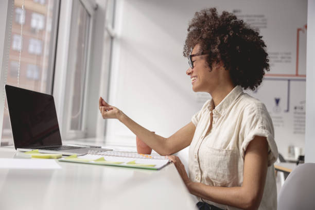 istock Afro American lady using laptop, watching lesson sign language online 1347470215