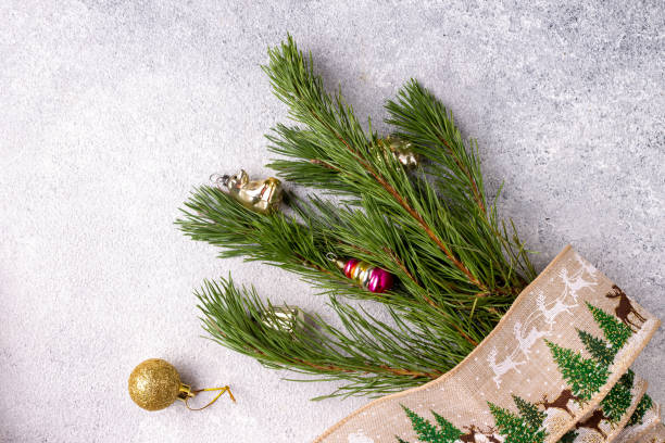 istock tree branch with toys tied with New Year's braid 1347470292