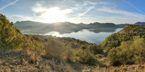 istock sunrise in a hilly landscape with a lake 1347470777
