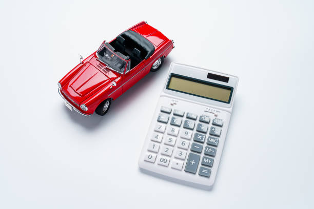 Calculator and sports car isolated on white background Calculator and sports car isolated on white background lorne stock pictures, royalty-free photos & images