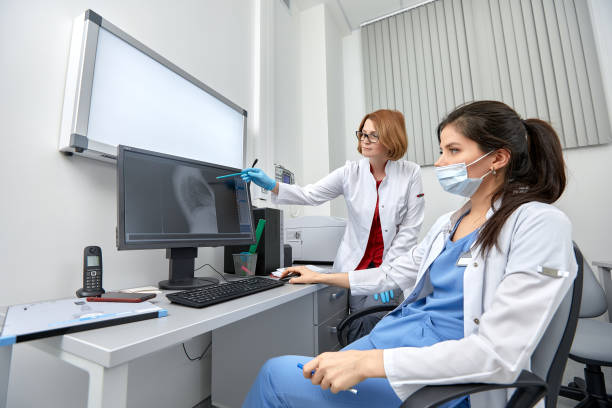 istock medical team discussing around a computer. Health care 1347473427
