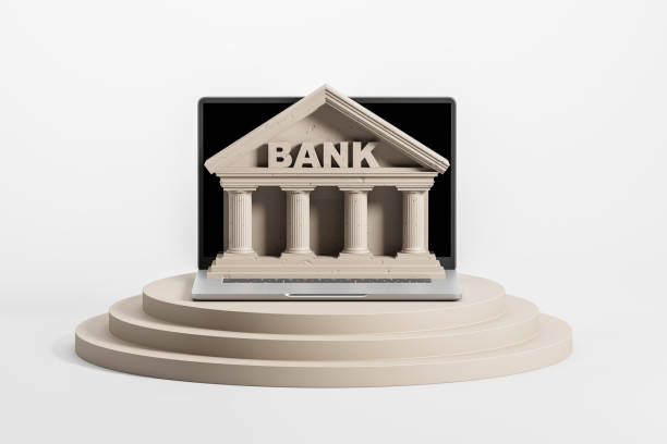 istock The laptop screen turned into a bank. Modern laptop on a white background on a platform. Online banking concept. 3d rendering 1347473603