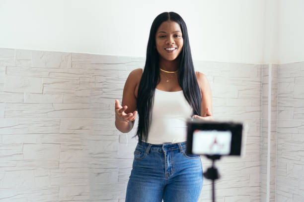istock A woman filming herself at home 1347473708