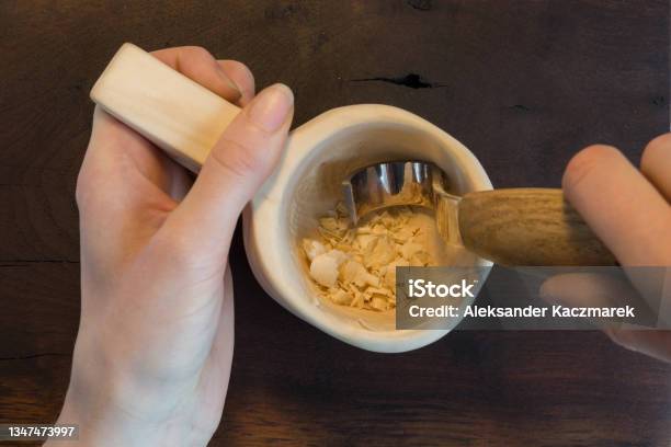Closeup Of Female Hands Carving Wooden Mug Kuksa On Dark Table Top View Stock Photo - Download Image Now